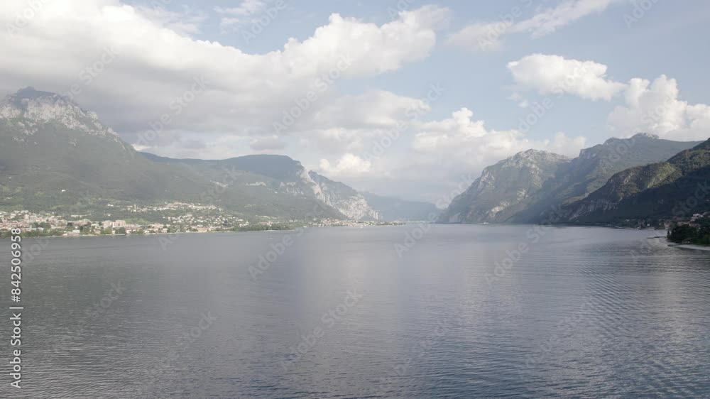 Flying Over Lake Como in Piemont, Italy. Panoramic aerial view of Lake Como in summer_backward shoot. Flying Over Lake Como in Piemont, Italy. Panoramic aerial view of Lake Como in summer_backward shoot.