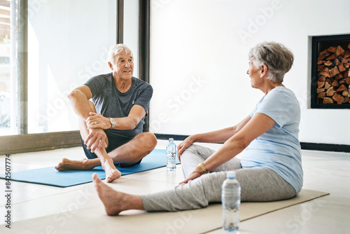 Fitness, senior couple and talking after yoga practice or workout for rest, recovery and weight loss. Retire, man and woman with smile, water bottle and nutrition conversation for health or wellness © peopleimages.com