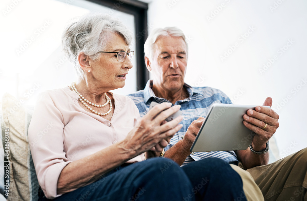 Senior couple, sofa and tablet with credit card in home for online shopping, payment and retirement plan. People, serious and couch at living room on internet banking, budget and investment finance Senior couple, sofa and tablet with credit card in home for online shopping, payment and retirement plan. People, serious and couch at living room on internet banking, budget and investment finance