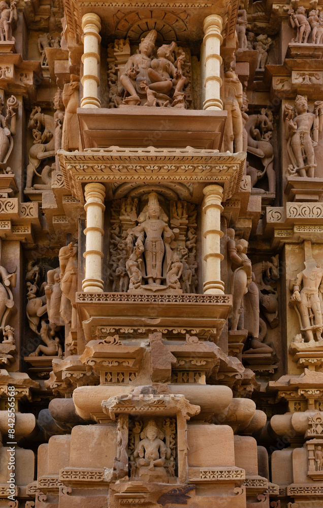 Fototapeta premium Ancient sculpture and intricate designs on the wall of Chitragupta Temple in the Khajuraho temple complex, India