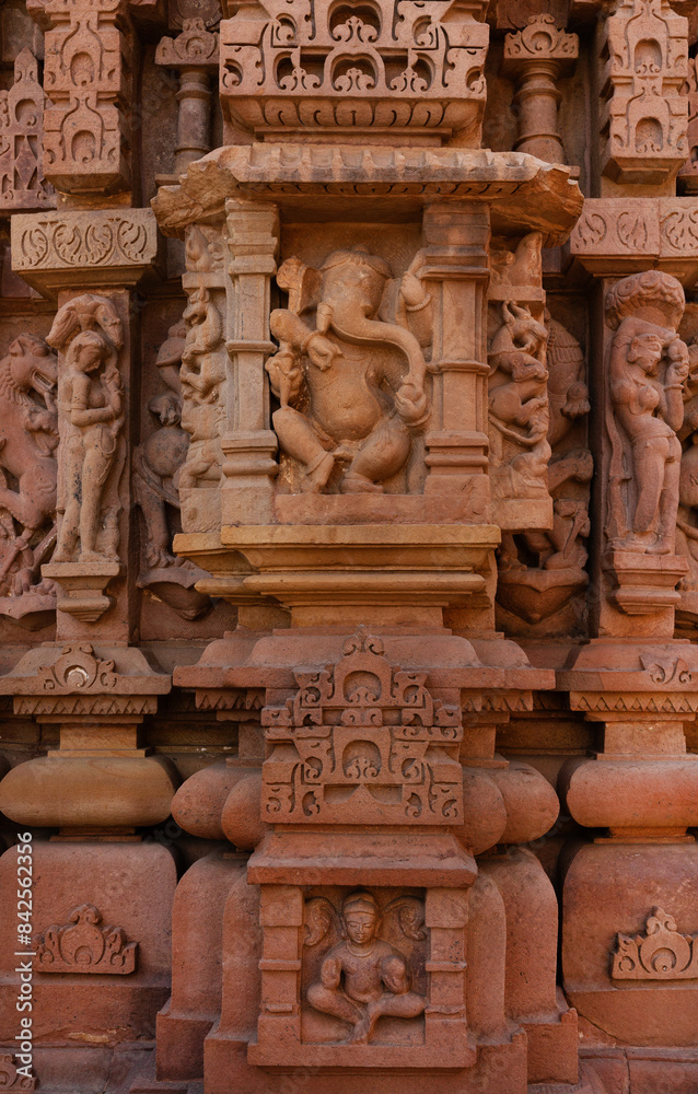 Ancient sculptures and intricate designs on the wall of Lakshmi Temple in the Khajuraho temple complex, India Ancient sculptures and intricate designs on the wall of Lakshmi Temple in the Khajuraho temple complex, India