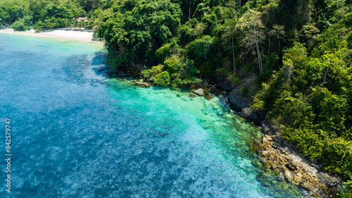 Aerial view of islands, Andaman Sea, natural blue waters and forests, tropical sea of Thailand. Beautiful scenery of the island with beautiful nature