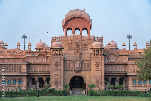 The image shows a grand building Junagarh fort palace in Bikaner set against a clear blue sky