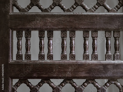 Wooden bars grid on a door in Islamic Moorish architecture art style in the Alcazaba fortress in Malaga, Spain