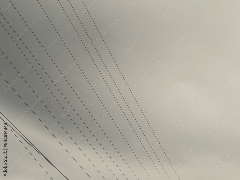 Minimalist Power Lines Against Cloudy Sky: A Study in Convergence and Contrast Minimalist Power Lines Against Cloudy Sky: A Study in Convergence and Contrast