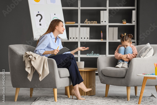 Female psychologist working...