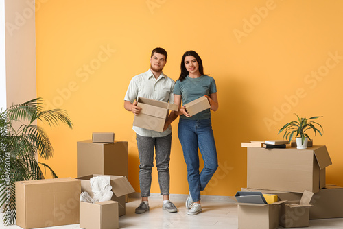 Young couple holding cardbo...