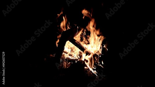 The Burning Bench. A mesmerizing slow-motion shot of a wooden bench burning fiercely, flames dancing across the surface.