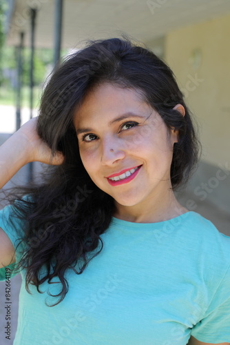 Beautiful Hispanic woman posing outdoors 