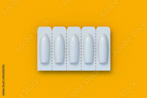 Принти на полотні Row of suppositories for vaginal or anal use on orange background