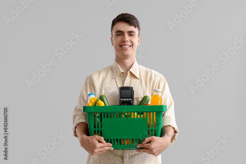 Young man with full shoppin...