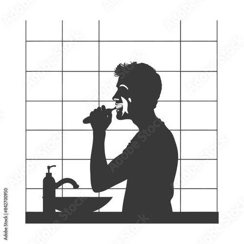 Silhouette of man brushing teeth in bathroom with tiled wall.