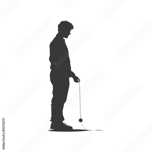 Silhouette of a pensive man playing with a yo-yo, nostalgic pastime.