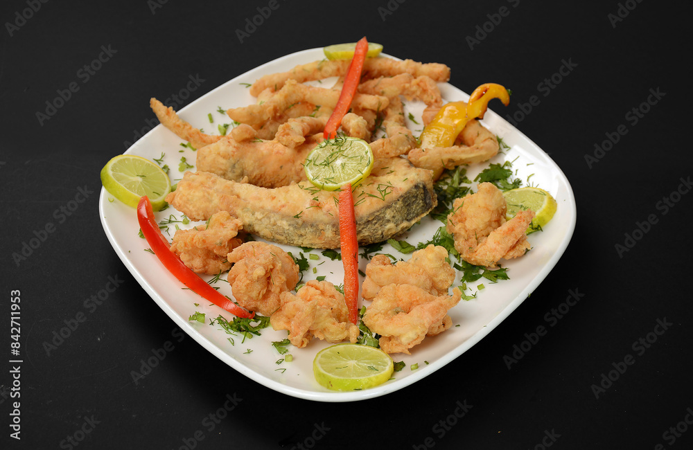 
deep fried seafood (shrimps and squid) with mix vegetable - unhealthy food style