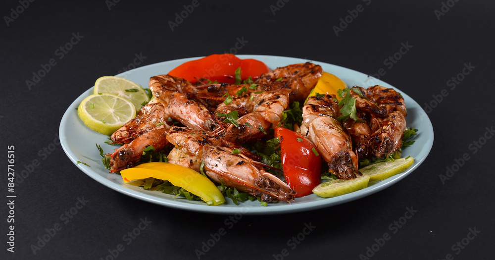 Grilled shrimp that's being cooked with smoke on the grill. Grilled shrimp that's being cooked with smoke on the grill.