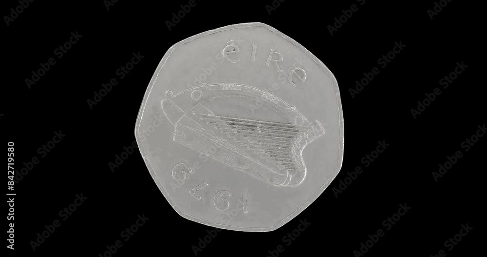 Obverse of Ireland coin 50 pence 1979, isolated in black background. Seamless animation in 4k resolution video. Obverse of Ireland coin 50 pence 1979, isolated in black background. Seamless animation in 4k resolution video.