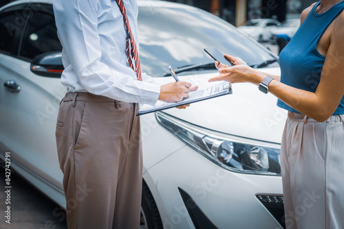 Bild auf Leinwand A young businesswoman is navigating car insurance options at her desk, considering premiums, deductibles, and coverage while understanding policies and managing claims efficiently