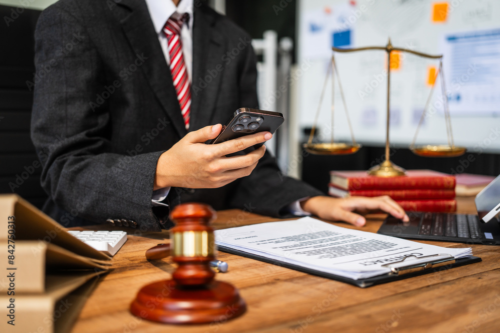 A young businesswoman is working at her desk, diligently preparing legal briefs and reviewing evidence for an upcoming trial, demonstrating her expertise as a lawyer in litigation and advocacy. A young businesswoman is working at her desk, diligently preparing legal briefs and reviewing evidence for an upcoming trial, demonstrating her expertise as a lawyer in litigation and advocacy.