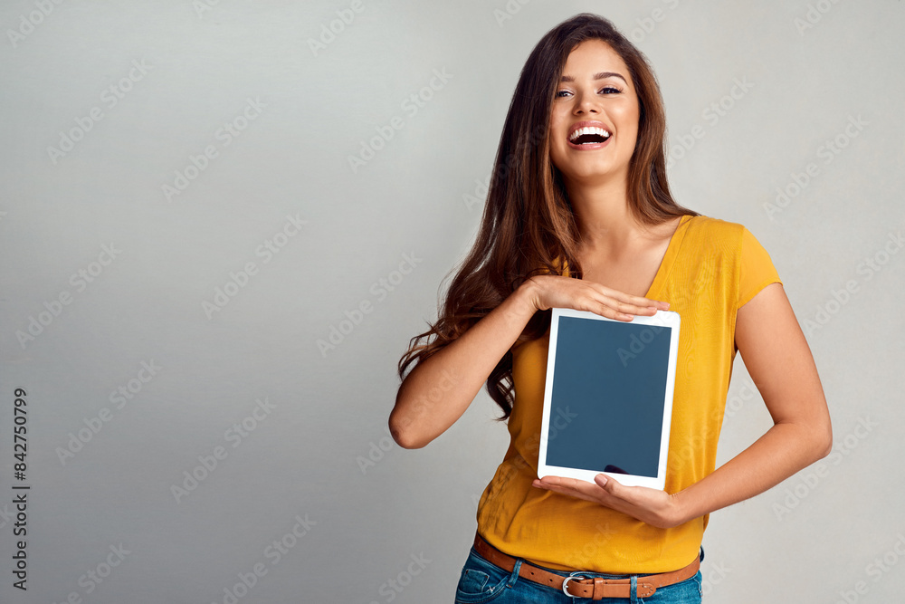 Excited woman, portrait and tablet with screen for advertising, marketing or app on a studio background. Happy female person, model or smile for technology display, presentation or showcase content Excited woman, portrait and tablet with screen for advertising, marketing or app on a studio background. Happy female person, model or smile for technology display, presentation or showcase content