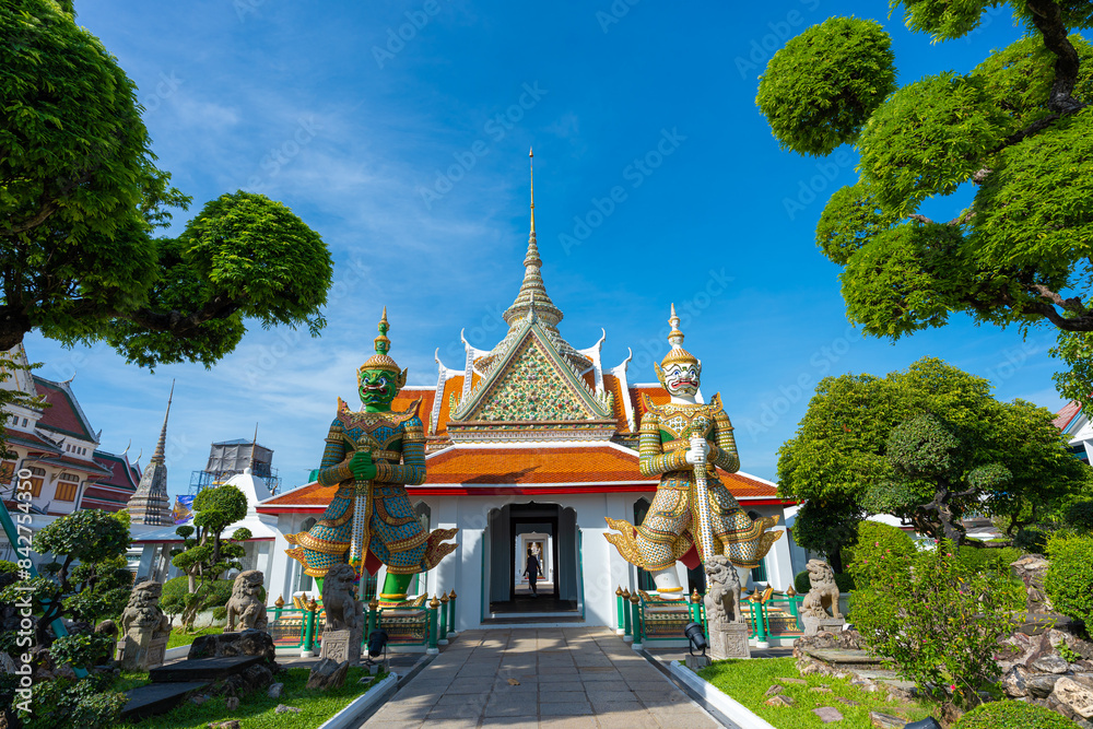 Pathway road to Ordination Hall with statues of Giants, demon guardians at Wat Arun Pathway road to Ordination Hall with statues of Giants, demon guardians at Wat Arun