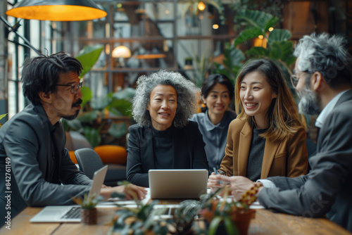 group of diverse professional businesspeople collaborating in a modern office, productive meeting