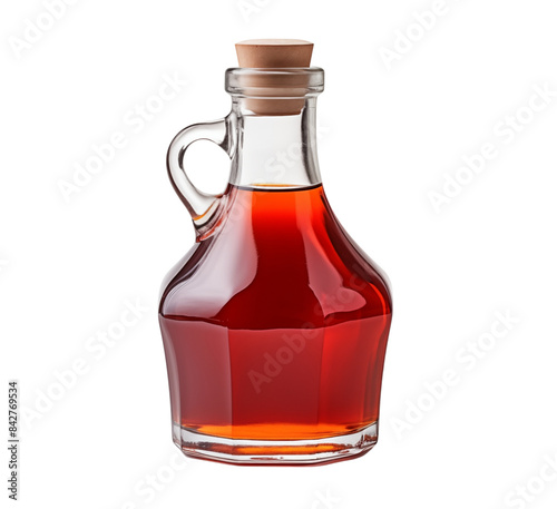 Savor the delicious sweetness of maple syrup, tastefully presented in a stunning glass bottle, ready for your enjoyment and culinary delights.
