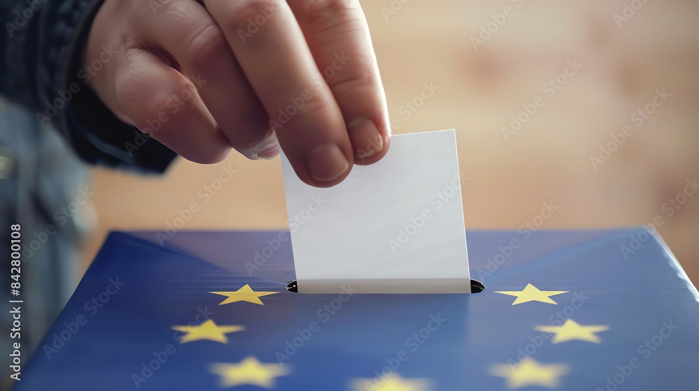 Hand placing ballot with European Union flag into ballot box. Hand placing ballot with European Union flag into ballot box.