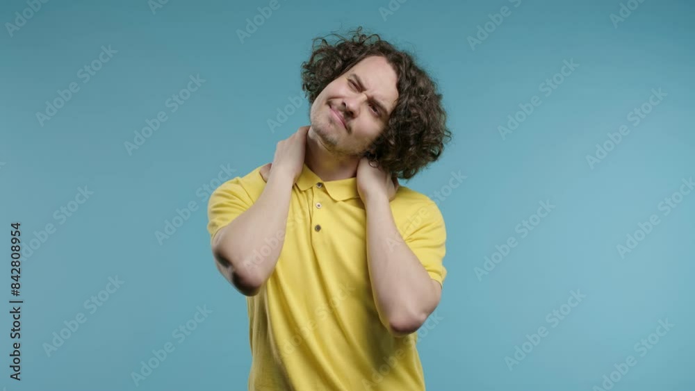 Tired man feeling pain in neck joint, massaging muscles, rubbing head. Arthritis Tired man feeling pain in neck joint, massaging muscles, rubbing head. Arthritis