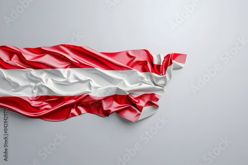 A vibrant image of the Austrian flag waving proudly on a solid gray background