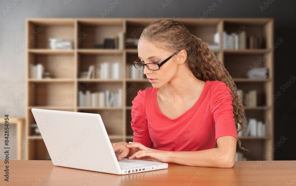 Cheerful young university student girl research in library Cheerful young university student girl research in library
