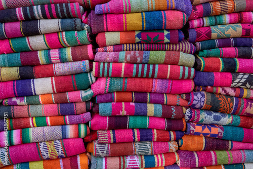 columns rustic striped blanket handmade or sale at an artisans' fair in northern argentina. Serape Design.