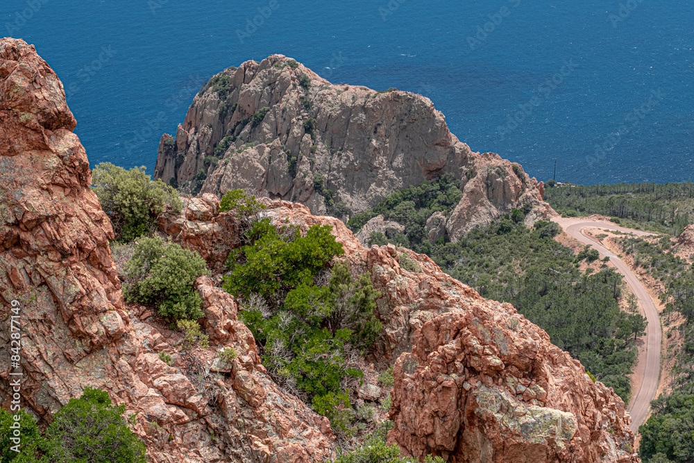 Massif de l'Esterel, a volcanic mountain range on the Mediterranean Sea coast on the French Riviera, located near Cannes on the east and Saint-Rafael on the west, France Massif de l'Esterel, a volcanic mountain range on the Mediterranean Sea coast on the French Riviera, located near Cannes on the east and Saint-Rafael on the west, France