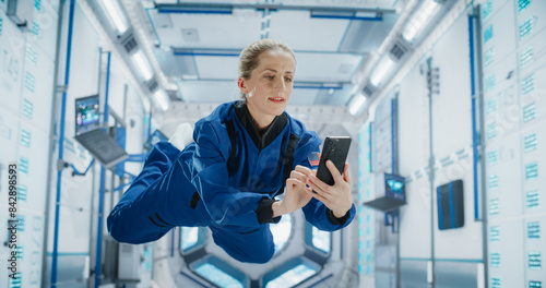 Photography Female Astronaut Floating in Zero Gravity Inside a Space Station