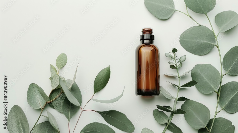 Cosmetic Product Mockup: Brown Glass Bottle with Blank Label and Eucalyptus on White Background, Large Copy Space Cosmetic Product Mockup: Brown Glass Bottle with Blank Label and Eucalyptus on White Background, Large Copy Space
