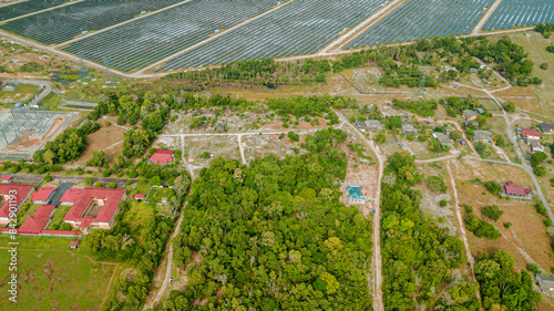 Aerial drone view of solar panels farm scenery at Pantai Jambu Bongkok, Marang, Terengganu, Malaysia. photo