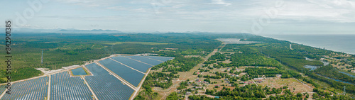 Aerial drone view of solar panels farm scenery at Pantai Jambu Bongkok, Marang, Terengganu, Malaysia.