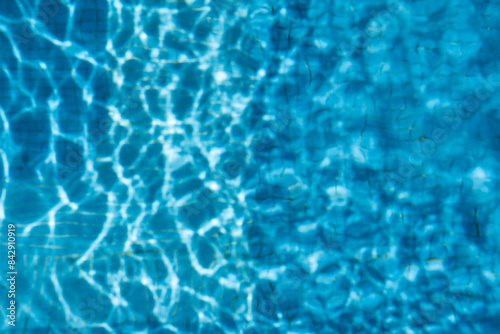 The texture of the water in the summer pool close-up.
