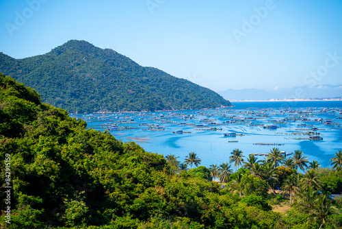 Aerial view of the lobster feeding farms, float fishing village in Vung Ro bay, Phu Yen, Vietnam. This is a very popular tourist destination.