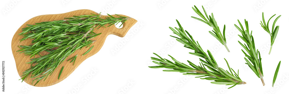 Rosemary twig and leaves on a wooden board isolated on white background Rosemary twig and leaves on a wooden board isolated on white background