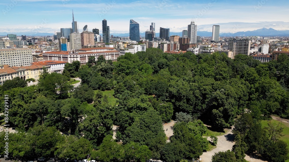 Italy, Milan , drone aerial view of Villa Reale and the new skyline with modern skyscrapers in downtown of the fashion city in Giardini di Porta Venezia Montanelli park . Milan Green city Italy, Milan , drone aerial view of Villa Reale and the new skyline with modern skyscrapers in downtown of the fashion city in Giardini di Porta Venezia Montanelli park . Milan Green city