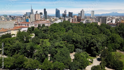 Italy, Milan , drone aerial view of Villa Reale and the new skyline with modern skyscrapers in downtown of the fashion city in Giardini di Porta Venezia Montanelli park . Milan Green city 