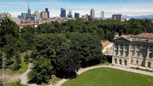 Obraz na płótnie Italy, Milan , drone aerial view of Villa Reale and the new skyline with modern skyscrapers in downtown of the fashion city in Giardini di Porta Venezia Montanelli park . Milan Green city w salonie