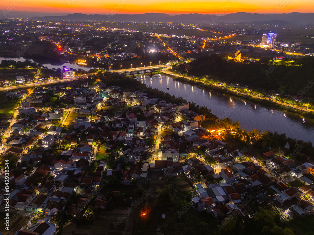 Fototapeta premium Aerial view of Nhan temple, tower is an artistic architectural work of Champa people in Tuy Hoa city, Phu Yen province, Vietnam. Sunset view