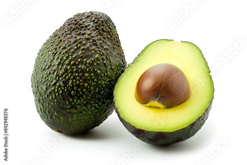 An avocado fruit cut in half isolated on white background