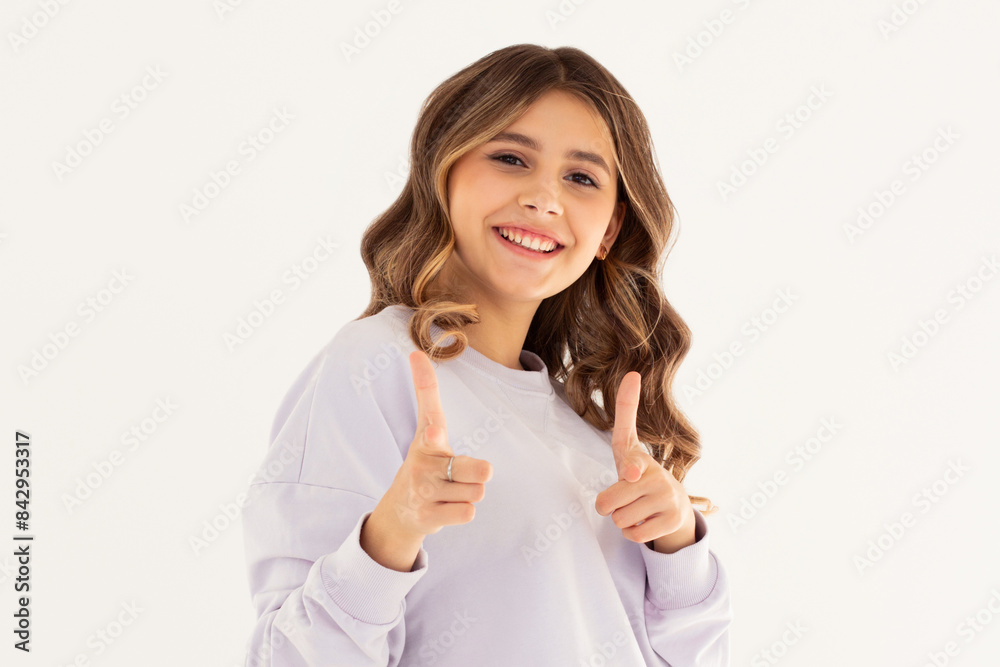 Young happy woman she wears purple sweatshirt casual clothes point index finger camera on you motivating encourage isolated on white background studio. Lifestyle concept Young happy woman she wears purple sweatshirt casual clothes point index finger camera on you motivating encourage isolated on white background studio. Lifestyle concept