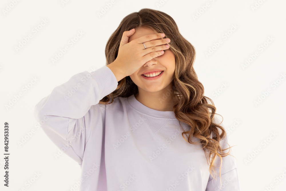 Photo portrait woman closed eyes with hand laughing playing game isolated white color background Photo portrait woman closed eyes with hand laughing playing game isolated white color background