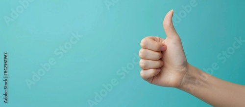 Left hand thumbs up copy space photo