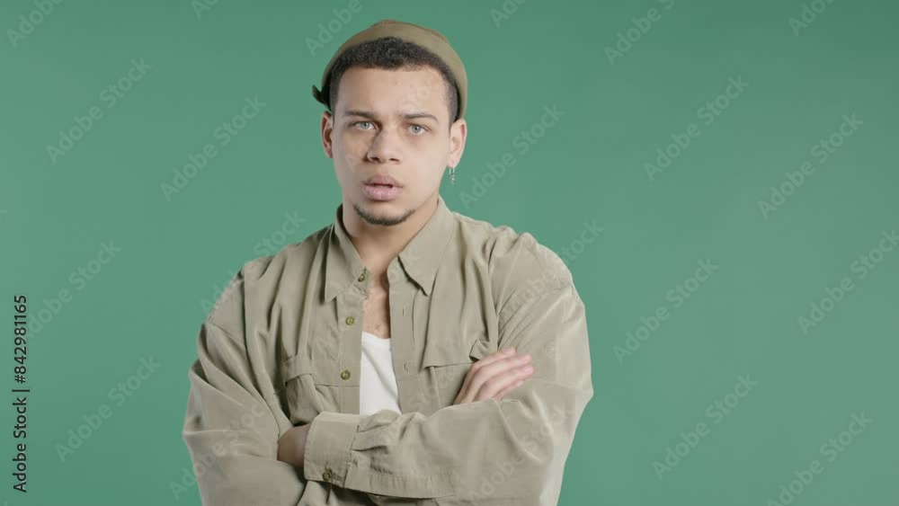 Annoyed Man Sighs, Rolling Eyes On Green Backdrop. Irritated Guy In Displeasure Annoyed Man Sighs, Rolling Eyes On Green Backdrop. Irritated Guy In Displeasure