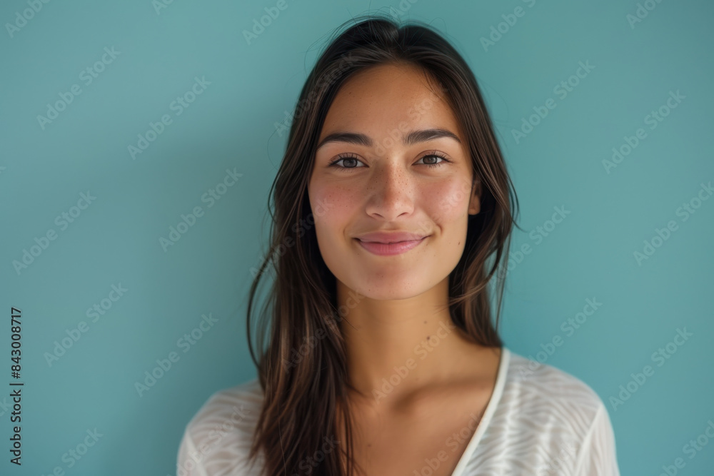 A close up portrait of a young woman with a subtle smile A close up portrait of a young woman with a subtle smile