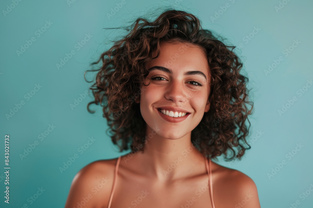 A close up portrait of a young woman with a subtle smile A close up portrait of a young woman with a subtle smile